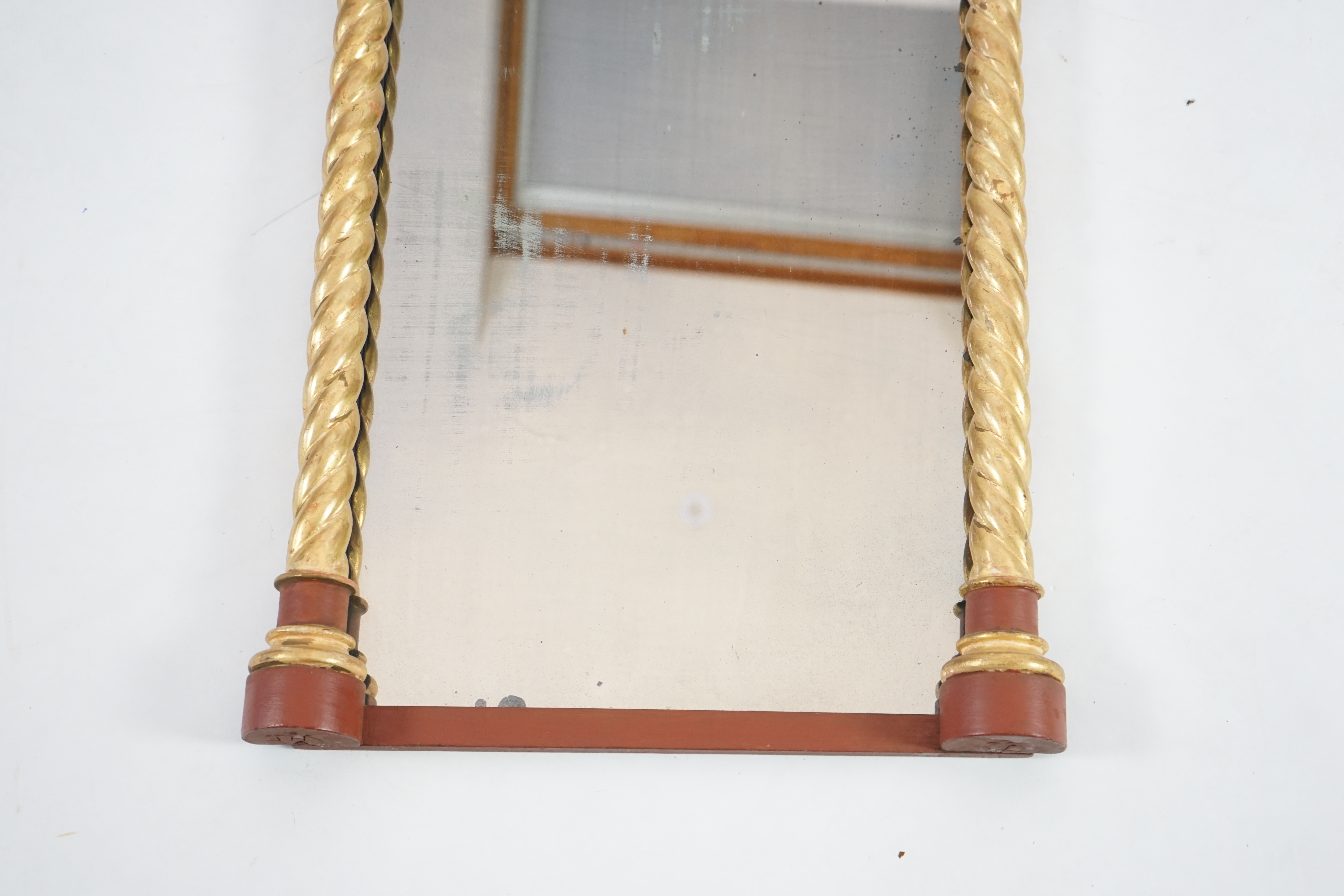 A Victorian Gothic revival painted and giltwood wall mirror